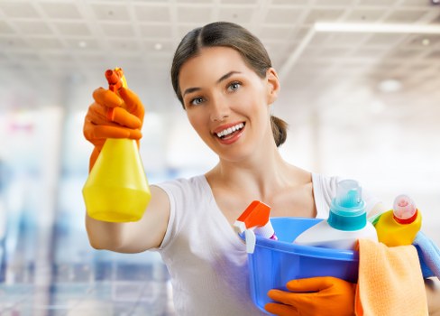 Trained carpet cleaner in SE15 wearing protective gloves and footwear