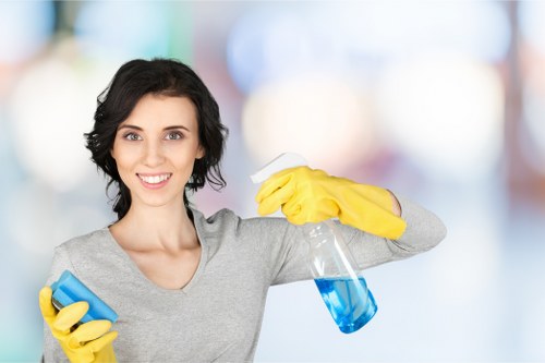 Cleaner using protective gloves and checking carpet cleaning chemicals