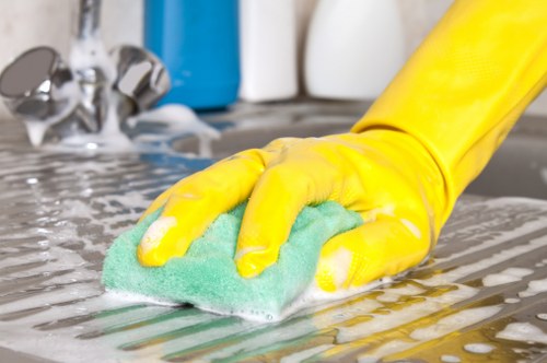 Cleaner noting service details during a carpet cleaning complaint review